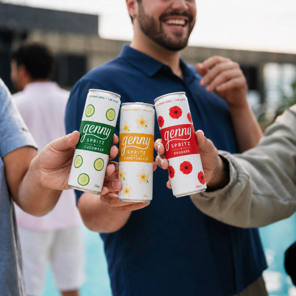 Friends toasting cans of genny spritz outdoors on a summer day